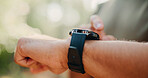 Checking, heart rate and hands with smart watch, outdoor and workout progress on fitness app or web. Park, wellness and person with tech for exercise update, scroll and health monitoring in nature