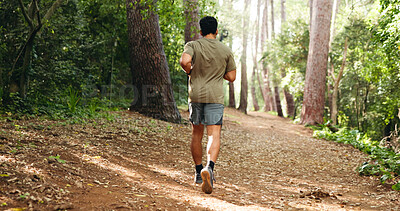 Buy stock photo Man, running or exercise with back view in forest for workout, outdoor training or hiking. Active, male person or runner with path on trekking trail for fitness, health or wellness in jungle or woods