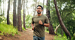 Fitness, workout and man in forest with running, cardio and stamina training in sport challenge. Serious, wellness and athlete in nature with jog, outdoor trail and endurance exercise in Costa Rica.