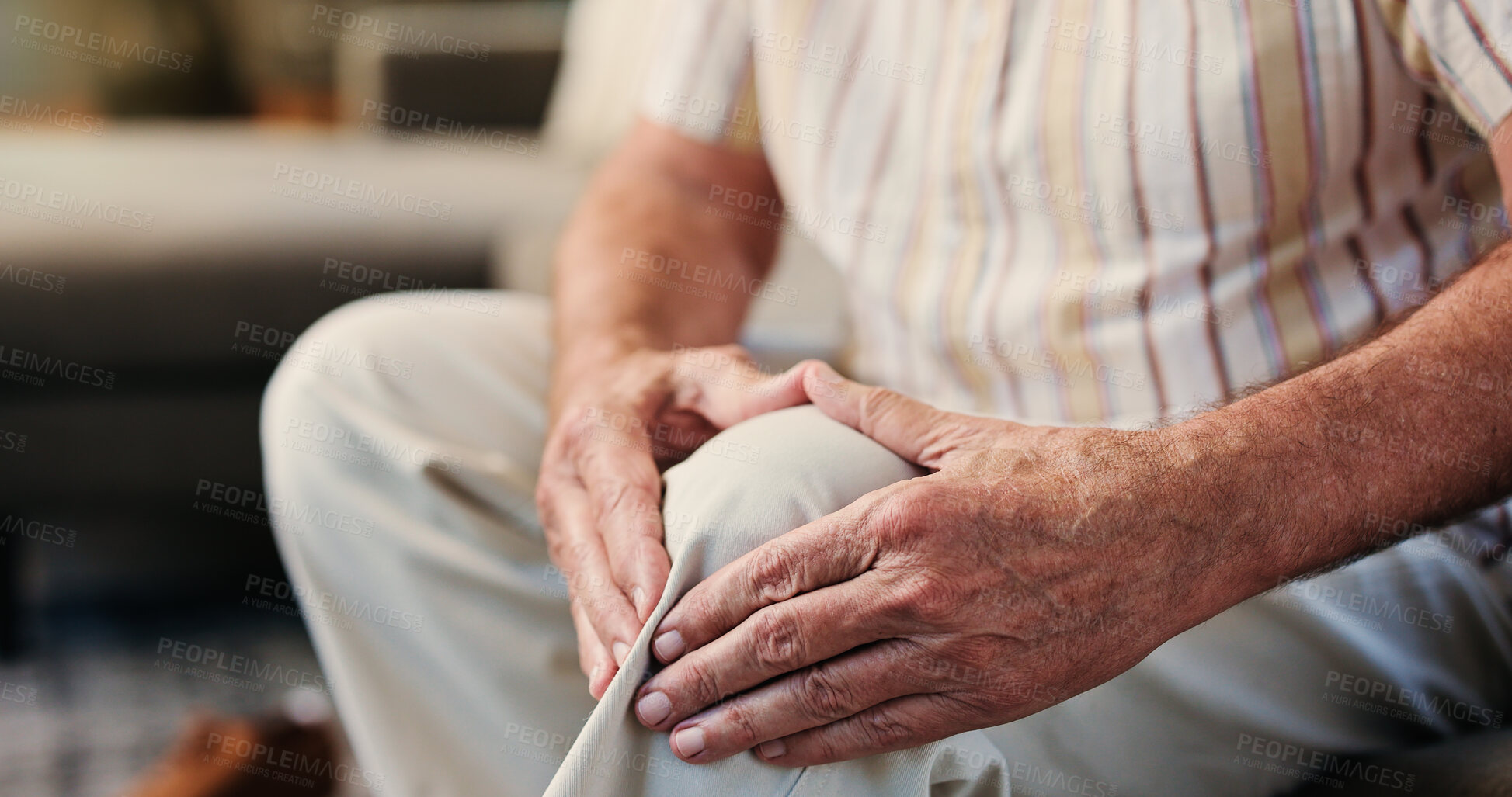 Buy stock photo House, hands and old man on couch, knee pain and joint injury with arthritis, bone fracture or sore. Closeup, pensioner and senior person with ache, discomfort and torn ligament with leg pressure
