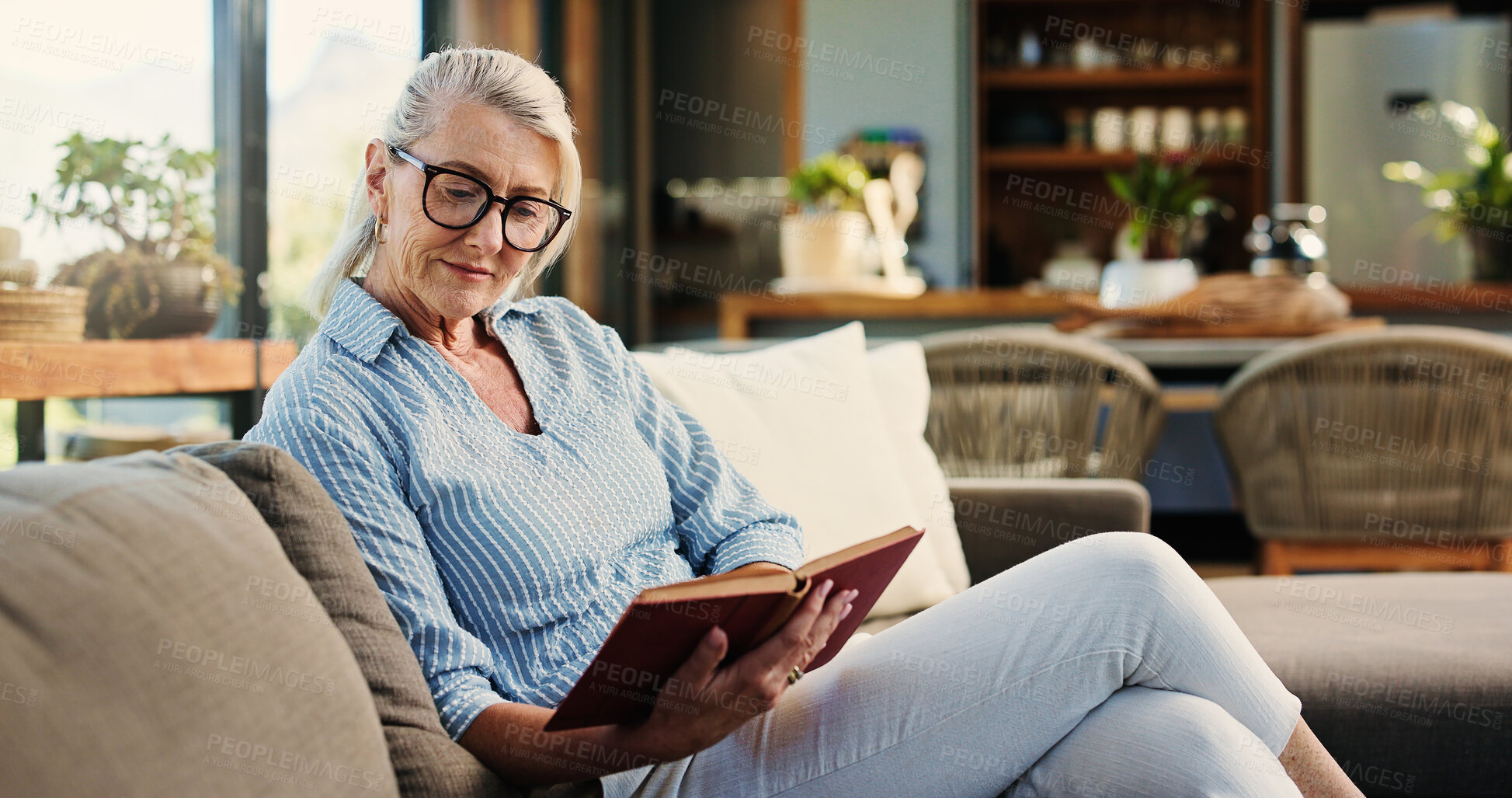 Buy stock photo Reading, book and senior woman in home with glasses, calm and literature insight on weekend rest. Free time, knowledge or mature person with specs, relax and information guide on Sunday afternoon.