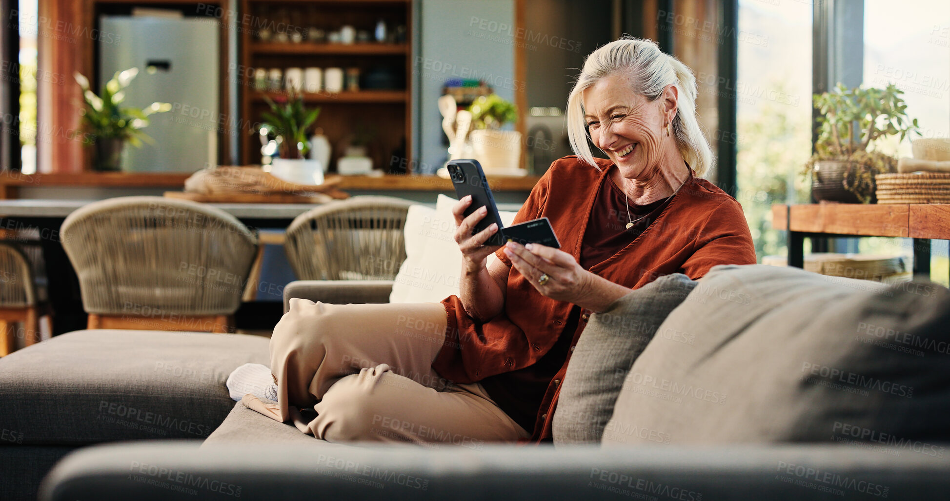 Buy stock photo Senior woman, phone and credit card for online shopping in home, easy payment and digital banking for bills. Person, smartphone and mobile app with ecommerce, fintech and retail discount at apartment