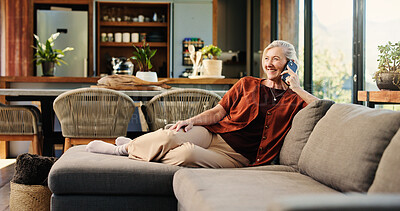 Buy stock photo Happy, woman and talking on sofa with phone call for news story, online gossip and relax on weekend. Mature person, smile and conversation with tech in home for contact, rumor update and feedback.