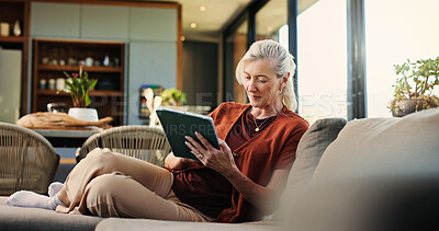 Buy stock photo Happy, woman and chill with tablet, lounge and watching videos on social media and app subscription. Online, entertainment and mature person with tech for movies, home and streaming series on website