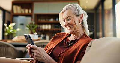 Buy stock photo Old woman, phone and laugh on couch with texting, notification and funny chat in living room at house. Person, smartphone and happy with mobile app, contact and social network on sofa at apartment