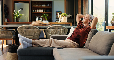 Buy stock photo Happy woman, thinking and relax on couch with stretching for peaceful moment, tranquility or daydreaming. Mature person, rest and reflection in home with smile for satisfaction, wellness and comfort.