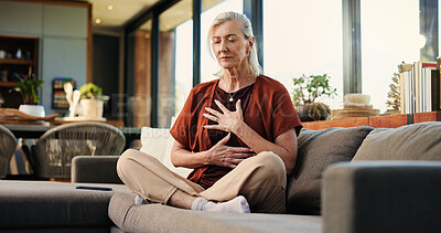 Buy stock photo Breathing, meditation and senior woman on sofa in home with balance, calm or zen practice in living room. Health, healing and elderly female person with grounding ritual for relax in apartment.