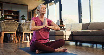 Buy stock photo Prayer hands, meditation and senior woman in home for balance, zen or calm with wellness. Breathing, chakra and elderly female person with yoga practice for spiritual mindfulness on mat in apartment.