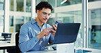 Phone, laptop and businessman in office with networking, communication or notification on mobile app. Cellphone, glasses and male person with message, texting or social media on break in workplace