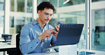 Buy stock photo Phone, laptop and businessman in office with networking, communication or notification on mobile app. Cellphone, glasses and male person with message, texting or social media on break in workplace