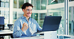 Celebration, fist pump and man with laptop in office for funding opportunity, good news and excited. Smile, email and person happy for business growth with investment, success or bonus achievement