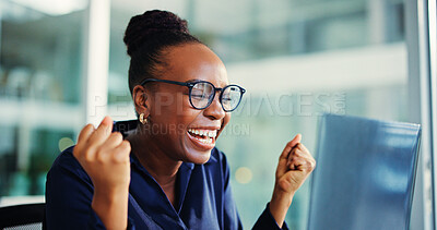 Buy stock photo Celebration, fist pump and black woman with laptop in office for funding goal, good news and excited. Smile, email and person happy for business growth with investment, success or bonus achievement