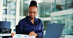 Laptop, paperwork and black woman with audit for finance review, research or analytics. Office, tech and business person with reading, graph or report for financial planning, agenda or project budget