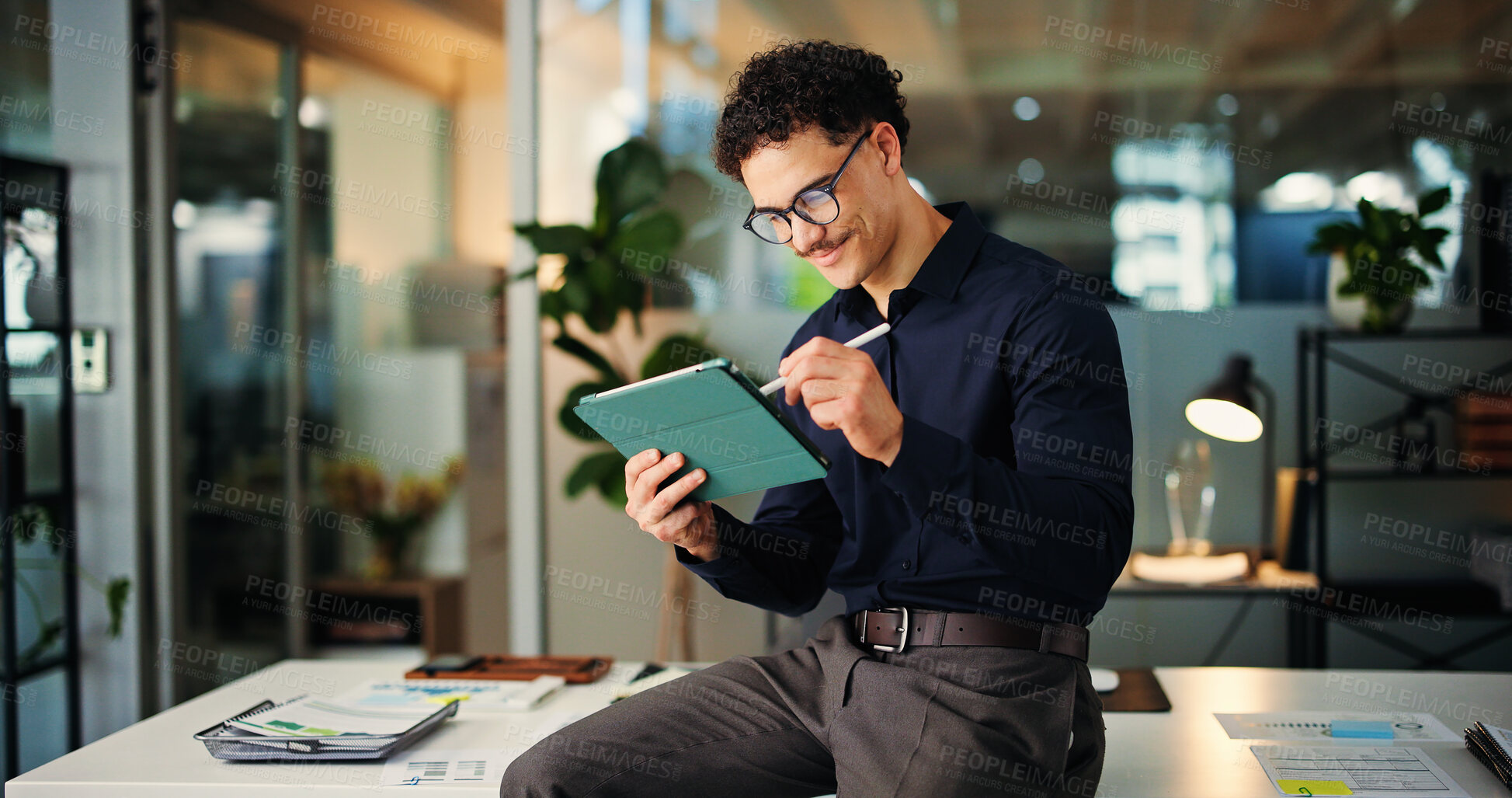 Buy stock photo Happy man, web designer and night with tablet for online website, design or development in office. Creative, businessman or working late with technology for schedule, review or planning in workplace