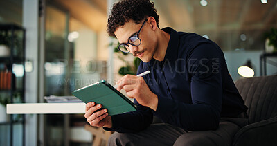 Buy stock photo Creative man, web designer or night with tablet for online website, design or development in office. Businessman, writing or working late with technology for schedule, review or planning in workplace