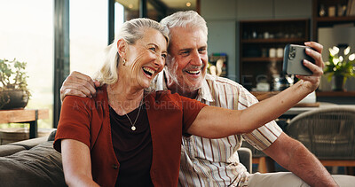 Buy stock photo Senior, happy couple and hug with selfie for photography, memory or anniversary picture in home. Elderly, man and woman with smile or love for capture moment, embrace or bonding together in house