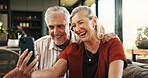 Video call, mature or couple in house with phone, connection or online conversation in living room. Happy, senior man or woman in home with tech, digital communication or bonding with virtual app.
