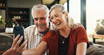 Buy stock photo Video call, mature or couple in house with phone, connection or online conversation in living room. Happy, senior man or woman in home with tech, digital communication or bonding with virtual app.