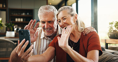 Buy stock photo Old couple, waving and phone for video call at house with discussion, friendly chat and webinar. Smile, elderly people and hello with mobile for online conversation, contact and laughing in lounge