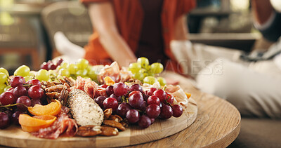 Buy stock photo House, charcuterie board and couple with love, fruit and nutrition with celebration. People, apartment and healthy with snack platter, protein and vitamins with Valentines day, romantic and food