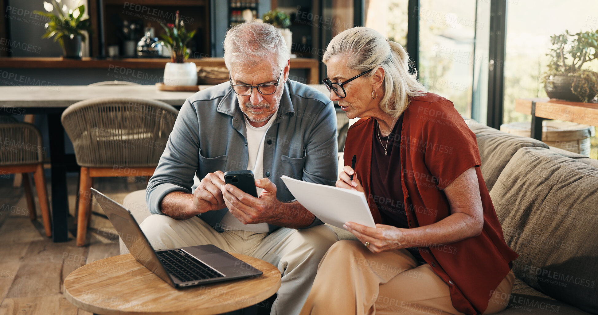 Buy stock photo House, documents and old couple with smartphone, laptop and mortgage with pension fund. Budget, man and woman on couch, cellphone and digital app for banking statement, savings or asset management
