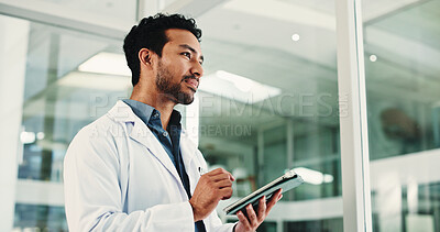 Buy stock photo Thinking, doctor and man in hospital, tablet and planning for healthcare report. Medical service, professional and person in clinic, solution or vision for future, thought and decision for schedule