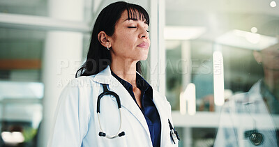 Buy stock photo Unhappy, woman and think in hospital, doctor and regret for operation failure, sad and mental health. Clinic, reflection and mature person with depression for loss, surgery or guilt for medical error