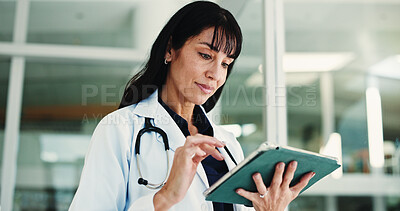 Buy stock photo Woman, doctor and reading with tablet in hospital for research, medical report and confirm surgery. Surgeon, digital and browsing website for Telehealth, healthcare results and treatment information
