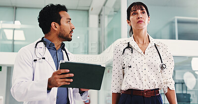 Buy stock photo Team, tablet and talking with doctors in hospital for walking, surgery schedule and healthcare. Patient records, planning and medical with people in clinic for online checklist, research and review