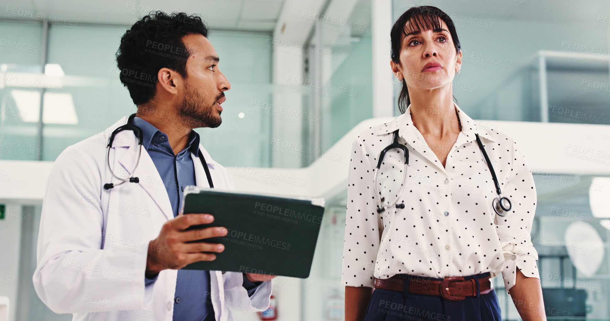 Buy stock photo Team, tablet and talking with doctors in hospital for walking, surgery schedule and healthcare. Patient records, planning and medical with people in clinic for online checklist, research and review