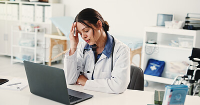 Buy stock photo Frustrated woman, doctor and headache with laptop for overworked strain or pressure in hospital. Tired, female person or medical worker with migraine on computer for stress, fatigue or burnout