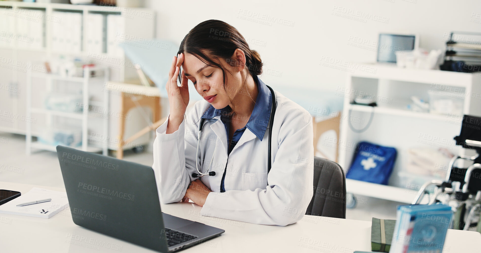 Buy stock photo Frustrated woman, doctor and headache with laptop for overworked strain or pressure in hospital. Tired, female person or medical worker with migraine on computer for stress, fatigue or burnout