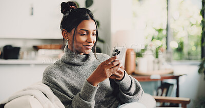 Buy stock photo Phone, typing and woman on sofa in home with texting, social media or networking on mobile app. Happy, tech and female person with cellphone for chatting, contact or communication in living room.