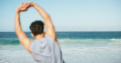 Buy stock photo Ocean, back and man with fitness, stretching and blur with waves, tropical island and wellness. Beach, routine and person with exercise, balance and training for health benefits, coastline or warm up