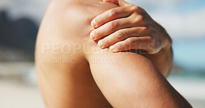 Buy stock photo Hand, shoulder and pain at beach with tension, inflammation or stiff joint with fibromyalgia. Person, topless with pressure or spasm of muscle ache, injury or body burnout with cramps outdoor