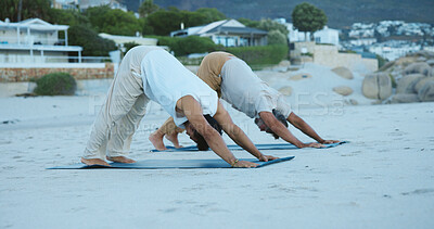 Buy stock photo Fitness, people and stretching at beach with yoga outdoor, holistic health and balance for wellness. Active, men and downward dog at ocean with stability, coordination and exercise for stress relief.