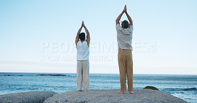 Buy stock photo Men, back view or meditation with beach for spiritual healing or wellness on ocean coast. Male people, yoga or reiki with tai chi or exercise for channeling body energy, flexibility or peace on space