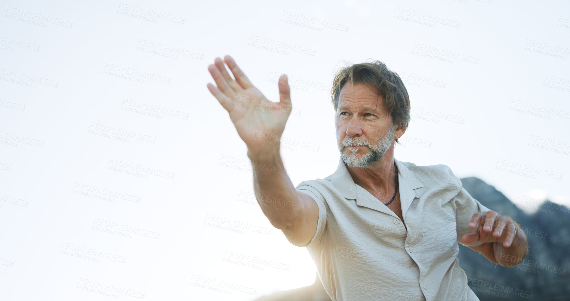 Buy stock photo Mature man, tai chi and martial art with space for spiritual healing, zen or wellness in nature. Male person, reiki or chakra with practice in motion or movement for channeling body energy or balance