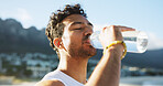 Athlete, man and drinking water for fitness outdoor for hydration, nutrition and exercise break. Male person, thirsty and bottle with refreshing beverage, liquid mineral and recovery from training