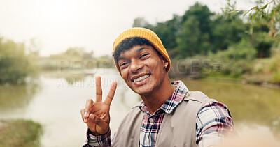 Buy stock photo Travel, peace sign and selfie with man in nature for adventure, social media post and hiking explorer. Vacation photography, trekking vlogger and lake with portrait pov of person for profile picture