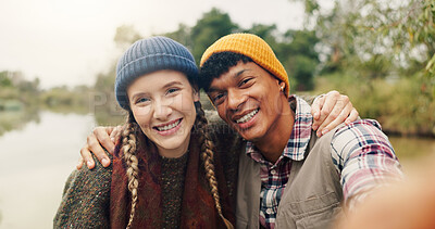 Buy stock photo Hug, selfie and smile with couple in nature for adventure, social media post and hiking explorer. Photography POV, trekking vlogger and lake with portrait of interracial people outdoor for honeymoon