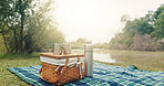 Empty,  picnic basket and camping in forest, lake and nature with weekend break, space and coffee. Flask, herbal tea and blanket for comfort, adventure and rest with thermos, morning and caffeine