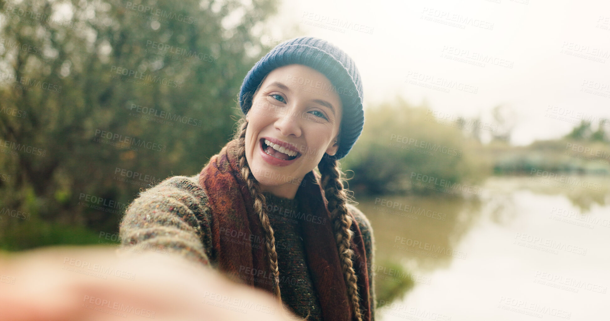 Buy stock photo Travel, vlog and smile with woman in nature for adventure, social media post and hiking explorer. Vacation photography, trekking vlogger and lake destination with person outdoor for profile picture