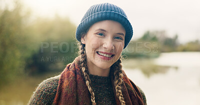 Buy stock photo Portrait, nature and happy woman in forest, lake and getaway trip with weekend break. Smile, beanie and person in woods, water and adventure with journey, gap year and vacation with pride in Sweden