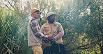 Men, friends and rod for fishing outdoor with instructions, casting technique and adventure. People, helping and fisherman with equipment in nature, reel guidance and weekend hobby for vacation trip