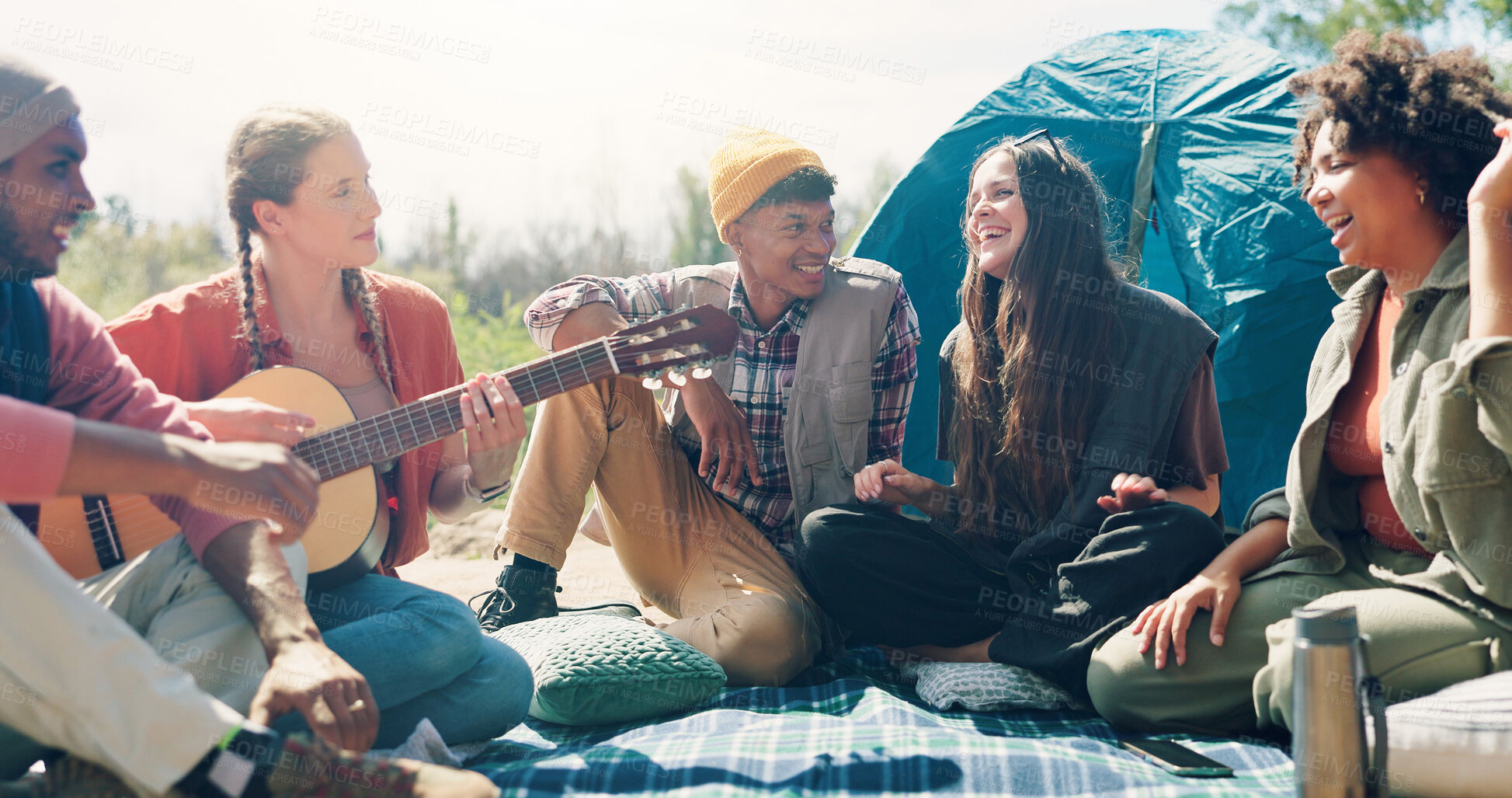 Buy stock photo Camping, guitar and people with smile, singing and bonding together for reunion. Friends, men and women with weekend break, musical instrument and summer holiday with nature, fun and celebration