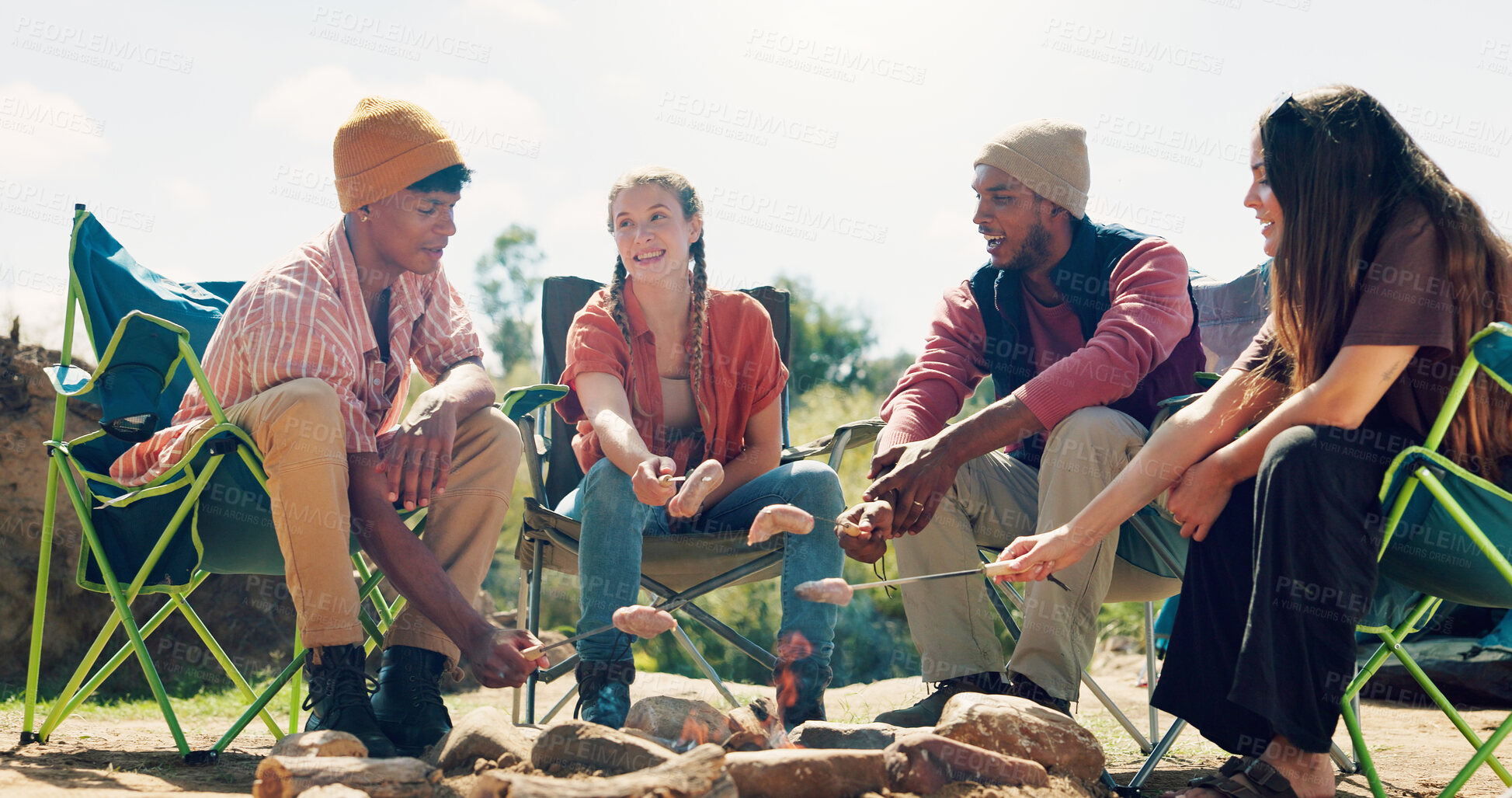 Buy stock photo Campfire, friends and people in forest, conversation and bonding together with weekend break. Healthy food, women and men in woods, discussion or vacation with getaway trip and relax in morning