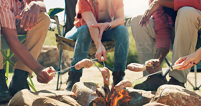 Buy stock photo Hands, campfire and group with cooking meat, outdoor and sausage on vacation, break and bonding in summer. People, friends and flames with food, hungry and relax outdoor in countryside on holiday