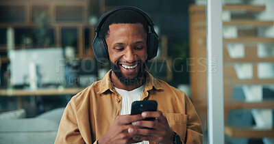 Buy stock photo Headphones, reading or happy man with phone in office, music listening or motivation podcast for work boost. Mobile, notification or black person streaming with audio app, workplace playlist or radio