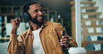 Phone, man and dancing with headphones in home office for feel good playlist, break and remote work. Freelancer, happy black person and movement with smartphone for streaming audio, rhythm and album